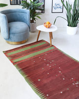 Vintage Turkish runner rug in a living room setting, pile rug, Turkish rug, vintage rug, portland, rug shop, bright colors, wild shaman, soft rug, bold color, Portland, Oregon, rug store, rug shop, local shop, antique rug