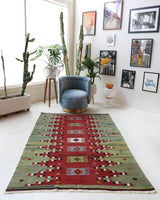 Vintage kilim rug in room decor setting, old rug, antique rug, pastel colors, faded colors, Turkish rug, vintage rug, soft rug, Portland, Oregon, rug store, rug shop, local shop, bold colors, bright colors, faded colors