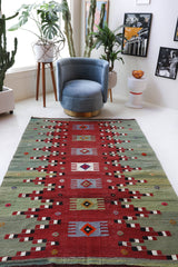 Vintage kilim rug in room decor setting, old rug, antique rug, pastel colors, faded colors, Turkish rug, vintage rug, soft rug, Portland, Oregon, rug store, rug shop, local shop, bold colors, bright colors, faded colors