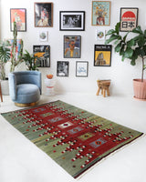 Vintage kilim rug in room decor setting, old rug, antique rug, pastel colors, faded colors, Turkish rug, vintage rug, soft rug, Portland, Oregon, rug store, rug shop, local shop, bold colors, bright colors, faded colors