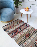 Vintage Turkish runner rug in living room setting, old rug, antique rug, pastel colors, faded colors, Turkish rug, vintage rug, soft rug, Portland, Oregon, rug store, rug shop, local shop