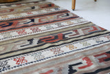 Vintage Turkish runner rug in living room setting, old rug, antique rug, pastel colors, faded colors, Turkish rug, vintage rug, soft rug, Portland, Oregon, rug store, rug shop, local shop