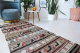 Vintage Turkish runner rug in living room setting, old rug, antique rug, pastel colors, faded colors, Turkish rug, vintage rug, soft rug, Portland, Oregon, rug store, rug shop, local shop