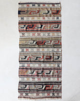 Vintage Turkish runner rug in living room setting, old rug, antique rug, pastel colors, faded colors, Turkish rug, vintage rug, soft rug, Portland, Oregon, rug store, rug shop, local shop