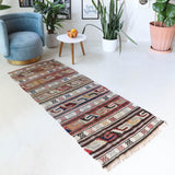 Vintage Turkish runner rug in living room setting, old rug, antique rug, pastel colors, faded colors, Turkish rug, vintage rug, soft rug, Portland, Oregon, rug store, rug shop, local shop