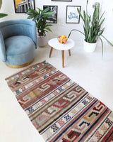 Vintage Turkish runner rug in living room setting, old rug, antique rug, pastel colors, faded colors, Turkish rug, vintage rug, soft rug, Portland, Oregon, rug store, rug shop, local shop
