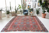 Vintage kilim rug in living room setting, old rug, antique rug, pastel colors, faded colors, Turkish rug, vintage rug, soft rug, Portland, Oregon, rug store, rug shop, local shop, earthy tones, earthy colors, warm colors