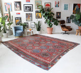 Vintage kilim rug in living room setting, old rug, antique rug, pastel colors, faded colors, Turkish rug, vintage rug, soft rug, Portland, Oregon, rug store, rug shop, local shop, earthy tones, earthy colors, warm colors