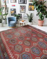 Vintage kilim rug in living room setting, old rug, antique rug, pastel colors, faded colors, Turkish rug, vintage rug, soft rug, Portland, Oregon, rug store, rug shop, local shop, earthy tones, earthy colors, warm colors