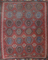 Vintage kilim rug in living room setting, old rug, antique rug, pastel colors, faded colors, Turkish rug, vintage rug, soft rug, Portland, Oregon, rug store, rug shop, local shop, earthy tones, earthy colors, warm colors