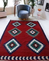 Vintage kilim rug in room decor setting, old rug, antique rug, pastel colors, faded colors, Turkish rug, vintage rug, soft rug, Portland, Oregon, rug store, rug shop, local shop, bold colors, bright colors, faded colors