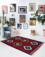 Vintage kilim rug in room decor setting, old rug, antique rug, pastel colors, faded colors, Turkish rug, vintage rug, soft rug, Portland, Oregon, rug store, rug shop, local shop, bold colors, bright colors, faded colors