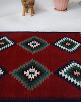 Vintage kilim rug in room decor setting, old rug, antique rug, pastel colors, faded colors, Turkish rug, vintage rug, soft rug, Portland, Oregon, rug store, rug shop, local shop, bold colors, bright colors, faded colors