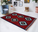 Vintage kilim rug in room decor setting, old rug, antique rug, pastel colors, faded colors, Turkish rug, vintage rug, soft rug, Portland, Oregon, rug store, rug shop, local shop, bold colors, bright colors, faded colors