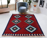 Vintage kilim rug in room decor setting, old rug, antique rug, pastel colors, faded colors, Turkish rug, vintage rug, soft rug, Portland, Oregon, rug store, rug shop, local shop, bold colors, bright colors, faded colors