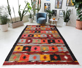 Vintage kilim rug in living room setting, bright colors, wild shaman, soft rug, bold color, Portland, Oregon, rug store, rug shop, local shop, vintage rug, modern kilim, warm colors