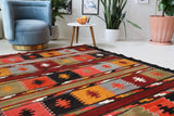 Vintage kilim rug in living room setting, bright colors, wild shaman, soft rug, bold color, Portland, Oregon, rug store, rug shop, local shop, vintage rug, modern kilim, warm colors