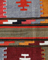 Vintage kilim rug in living room setting, bright colors, wild shaman, soft rug, bold color, Portland, Oregon, rug store, rug shop, local shop, vintage rug, modern kilim, warm colors