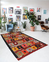 Vintage kilim rug in living room setting, bright colors, wild shaman, soft rug, bold color, Portland, Oregon, rug store, rug shop, local shop, vintage rug, modern kilim, warm colors