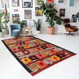 Vintage kilim rug in living room setting, bright colors, wild shaman, soft rug, bold color, Portland, Oregon, rug store, rug shop, local shop, vintage rug, modern kilim, warm colors