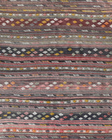 Vintage kilim rug in living room setting, old rug, antique rug, pastel colors, faded colors, Turkish rug, vintage rug, soft rug, Portland, Oregon, rug store, rug shop, local shop, earthy tones, earthy colors, warm colors