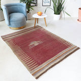 Vintage kilim rug in living room setting, old rug, antique rug, pastel colors, faded colors, Turkish rug, vintage rug, soft rug, Portland, Oregon, rug store, rug shop, local shop, earthy tones, earthy colors, warm colors