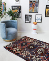 Vintage Turkish runner rug in a living room setting, pile rug, Turkish rug, vintage rug, portland, rug shop, bright colors, wild shaman, soft rug, bold color, Portland, Oregon, rug store, rug shop, local shop, antique rug