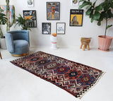 Vintage Turkish runner rug in a living room setting, pile rug, Turkish rug, vintage rug, portland, rug shop, bright colors, wild shaman, soft rug, bold color, Portland, Oregon, rug store, rug shop, local shop, antique rug