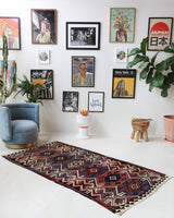 Vintage Turkish runner rug in a living room setting, pile rug, Turkish rug, vintage rug, portland, rug shop, bright colors, wild shaman, soft rug, bold color, Portland, Oregon, rug store, rug shop, local shop, antique rug