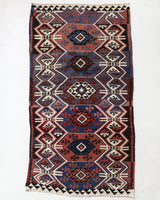 Vintage Turkish runner rug in a living room setting, pile rug, Turkish rug, vintage rug, portland, rug shop, bright colors, wild shaman, soft rug, bold color, Portland, Oregon, rug store, rug shop, local shop, antique rug