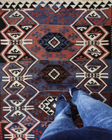 Vintage Turkish runner rug in a living room setting, pile rug, Turkish rug, vintage rug, portland, rug shop, bright colors, wild shaman, soft rug, bold color, Portland, Oregon, rug store, rug shop, local shop, antique rug