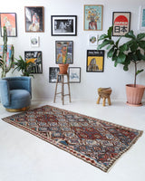 Vintage kilim rug in room decor setting, old rug, antique rug, pastel colors, faded colors, Turkish rug, vintage rug, soft rug, Portland, Oregon, rug store, rug shop, local shop, bold colors, bright colors, faded colors