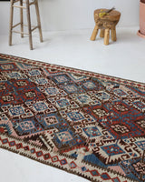 Vintage kilim rug in room decor setting, old rug, antique rug, pastel colors, faded colors, Turkish rug, vintage rug, soft rug, Portland, Oregon, rug store, rug shop, local shop, bold colors, bright colors, faded colors