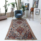 Vintage kilim rug in room decor setting, old rug, antique rug, pastel colors, faded colors, Turkish rug, vintage rug, soft rug, Portland, Oregon, rug store, rug shop, local shop, bold colors, bright colors, faded colors