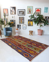 Vintage kilim rug in living room setting, bright colors, wild shaman, soft rug, bold color, Portland, Oregon, rug store, rug shop, local shop, vintage rug, modern kilim, warm colors