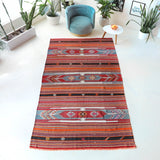 Vintage kilim rug in room decor setting, old rug, antique rug, pastel colors, faded colors, Turkish rug, vintage rug, soft rug, Portland, Oregon, rug store, rug shop, local shop, bold colors, bright colors,