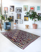 Vintage kilim rug in living room setting, old rug, antique rug, pastel colors, faded colors, Turkish rug, vintage rug, soft rug, Portland, Oregon, rug store, rug shop, local shop, earthy tones, earthy colors, warm colors