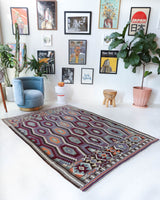 Vintage kilim rug in living room setting, old rug, antique rug, pastel colors, faded colors, Turkish rug, vintage rug, soft rug, Portland, Oregon, rug store, rug shop, local shop, earthy tones, earthy colors, warm colors