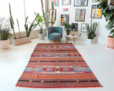 Vintage kilim rug in room decor setting, old rug, antique rug, pastel colors, faded colors, Turkish rug, vintage rug, soft rug, Portland, Oregon, rug store, rug shop, local shop, bold colors, bright colors,