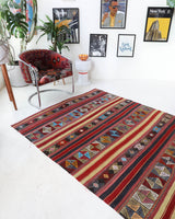 Vintage kilim rug in room decor setting, old rug, antique rug, pastel colors, faded colors, Turkish rug, vintage rug, soft rug, Portland, Oregon, rug store, rug shop, local shop, bold colors, bright colors, faded colors