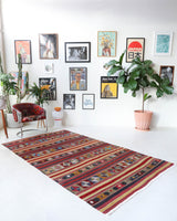 Vintage kilim rug in room decor setting, old rug, antique rug, pastel colors, faded colors, Turkish rug, vintage rug, soft rug, Portland, Oregon, rug store, rug shop, local shop, bold colors, bright colors, faded colors