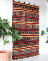 Vintage kilim rug in room decor setting, old rug, antique rug, pastel colors, faded colors, Turkish rug, vintage rug, soft rug, Portland, Oregon, rug store, rug shop, local shop, bold colors, bright colors, faded colors