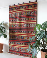 Vintage kilim rug in room decor setting, old rug, antique rug, pastel colors, faded colors, Turkish rug, vintage rug, soft rug, Portland, Oregon, rug store, rug shop, local shop, bold colors, bright colors, faded colors