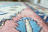 Vintage Turkish rug in living room setting, old rug, antique rug, pastel colors, faded colors, Turkish rug, vintage rug, soft rug, Portland, Oregon, rug store, rug shop, local shop