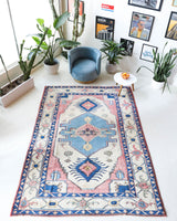 Vintage Turkish rug in living room setting, old rug, antique rug, pastel colors, faded colors, Turkish rug, vintage rug, soft rug, Portland, Oregon, rug store, rug shop, local shop
