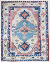 Vintage Turkish rug in living room setting, old rug, antique rug, pastel colors, faded colors, Turkish rug, vintage rug, soft rug, Portland, Oregon, rug store, rug shop, local shop
