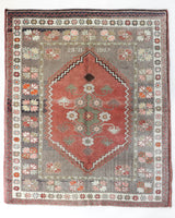 Vintage Turkish rug in living room setting, old rug, antique rug, pastel colors, faded colors, Turkish rug, vintage rug, soft rug, Portland, Oregon, rug store, rug shop, local shop