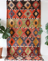 Vintage kilim rug in living room setting, bright colors, wild shaman, soft rug, bold color, Portland, Oregon, rug store, rug shop, local shop, vintage rug, modern kilim, warm colors