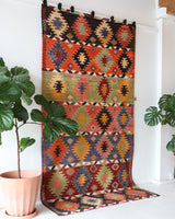 Vintage kilim rug in living room setting, bright colors, wild shaman, soft rug, bold color, Portland, Oregon, rug store, rug shop, local shop, vintage rug, modern kilim, warm colors