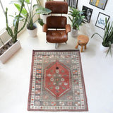 Vintage Turkish rug in living room setting, old rug, antique rug, pastel colors, faded colors, Turkish rug, vintage rug, soft rug, Portland, Oregon, rug store, rug shop, local shop